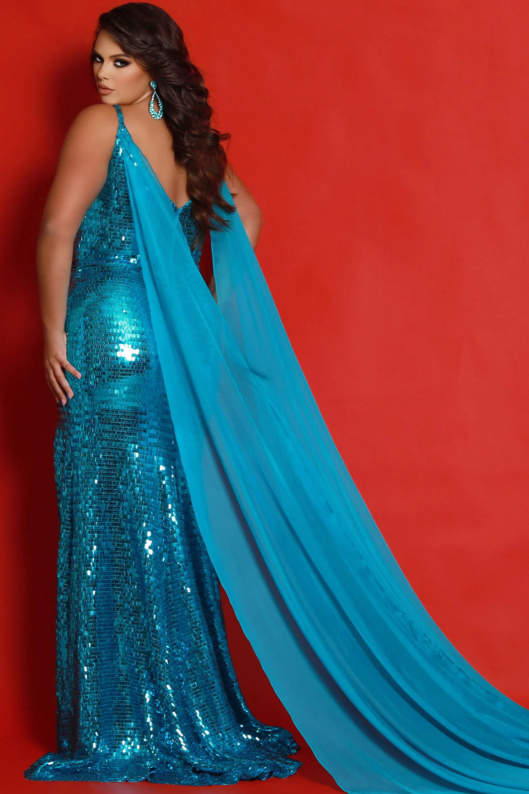 The Sydneys Closet JK2413 is a stunning long, fitted plus size prom dress with a sequin cape and a plunging neckline, V-back, and slit. The perfect dress for a special occasion, this gown is sure to make you stand out. Strut your stuff at any formal evening in this glamorous plus size sequin pageant gown. The Shocks floor-length evening dress dazzles in overall piano key fabric that sparkles all night.