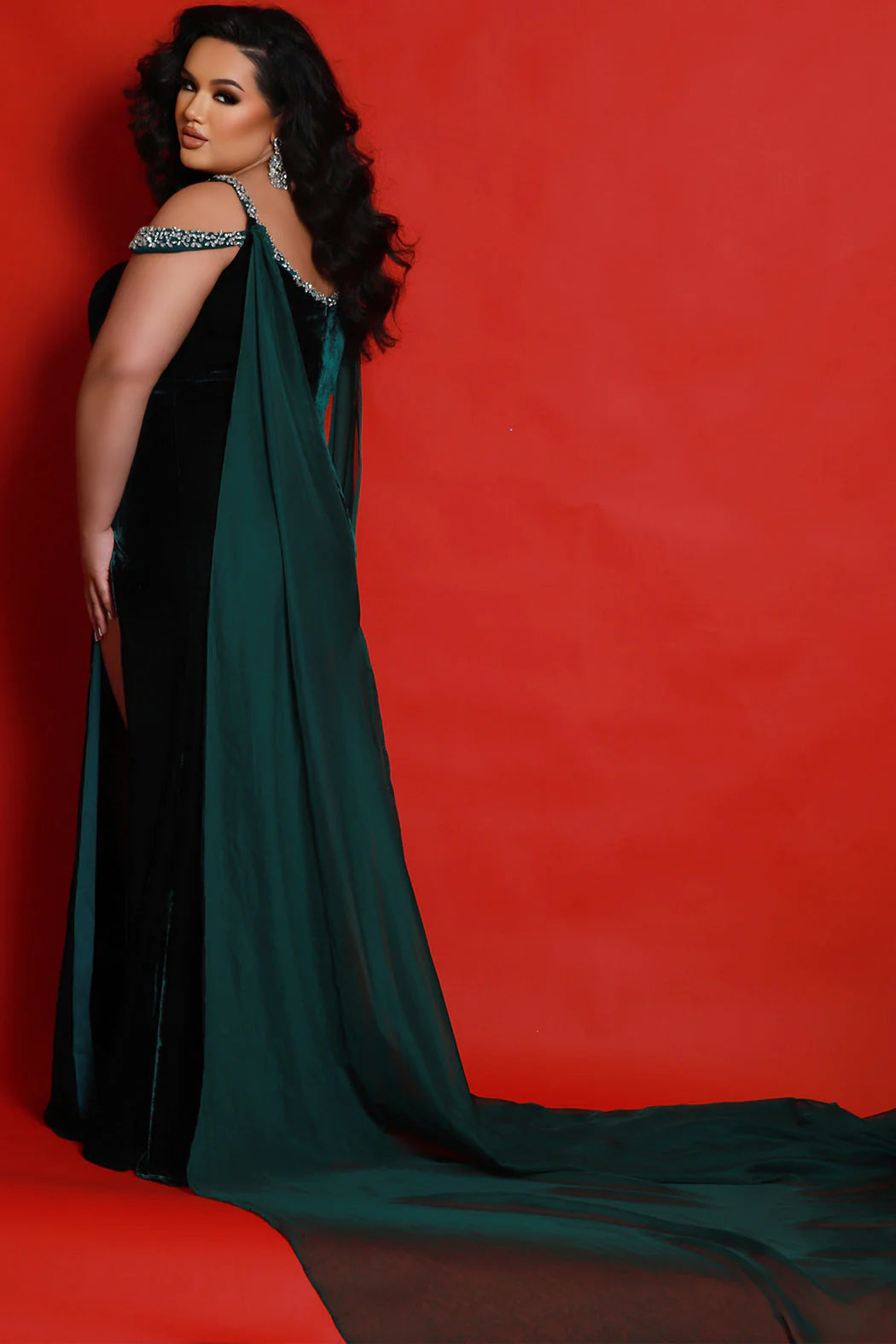 Look your best in Sydneys Closet JK2420 Prom Dress. Featuring an off-the-shoulder cape train and a plus-size silhouette, this upscale fitted velvet pageant dress elevates your look with a high slit and a red-carpet style. Perfect for special occasions. You can bet on being a fashion winner at Prom, Pageant, black-tie events when you roll the dice on the oh- so elegant Monte Carlo plus-size evening pageant gown in rich stretch velvet. 