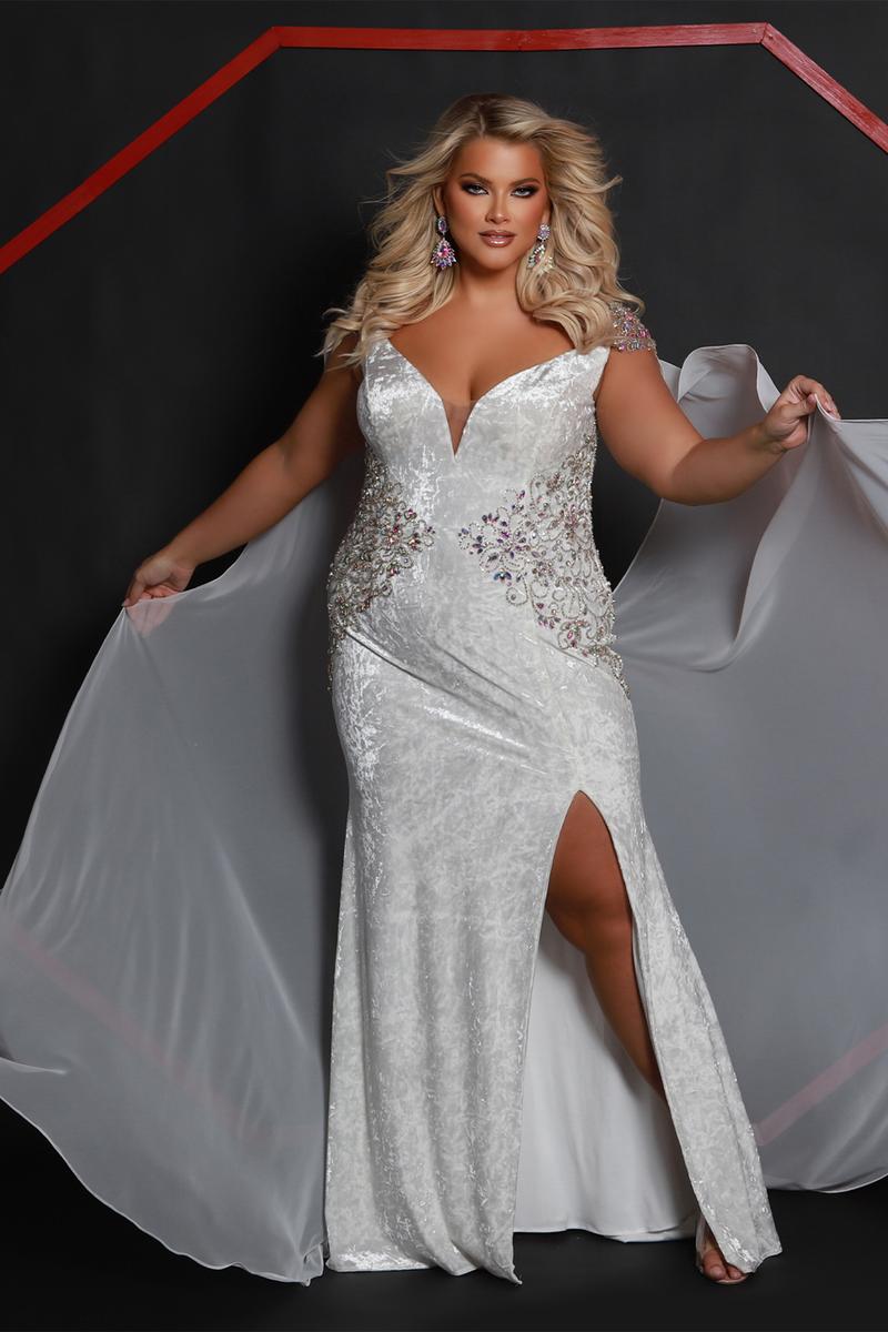 Make a grand entrance in this stunning Sydney Closet pageant gown! This elegant white velvet dress features a dramatic cape that commands attention, while sheer crystal-embellished sides and a sophisticated slit add modern flair. Perfect for pageant competitions, formal events, or any occasion where you want to shine like royalty. The luxurious velvet fabric drapes beautifully, ensuring you look and feel absolutely fabulous. Size 16 ready to dazzle!

Size: 16

Color White