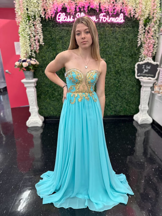 <p><span>Johnathan Kayne 502 pageant dress For the romantic at heart, this classic chiffon silhouette outshines with a bodice fit for a princess. Clear glass crystals and gold embroidery scroll around this alluring bodice that scoops down into a tear drop mesh cutout.&nbsp; Evening gown Prom Dress</span></p> <p><span>Size 0 - Aqua/Gold</span></p>