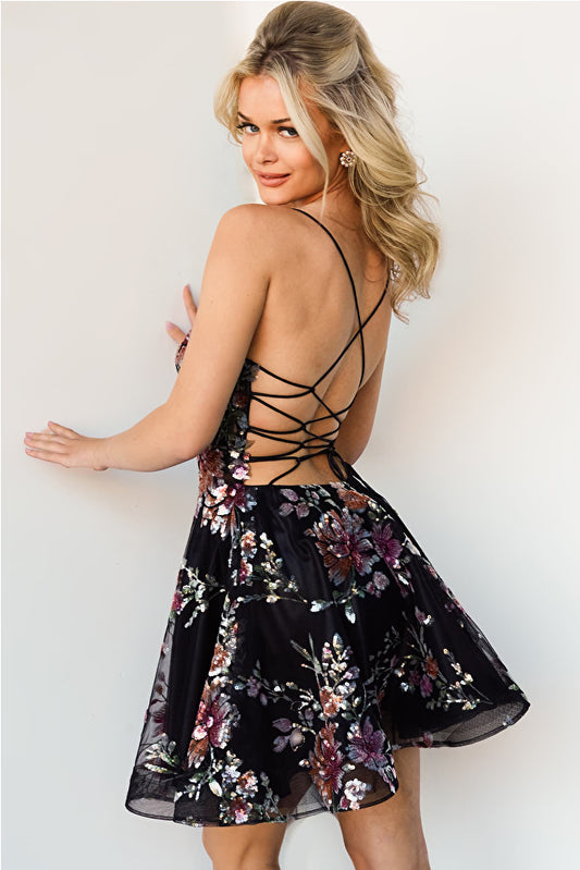 Jovani JVN23352 Floral Sequin V-Neck Lace Up Back Fit And Flare Short Cocktail Homecoming Dress. This Jovani JVN23352 dress features a beaded floral sequin pattern on its V-neckline, lace-up back and body-hugging fit. It has a flattering flared silhouette that ends in a short hem for an ultra-feminine look. Perfect for homecoming, cocktail parties, and other special occasions.