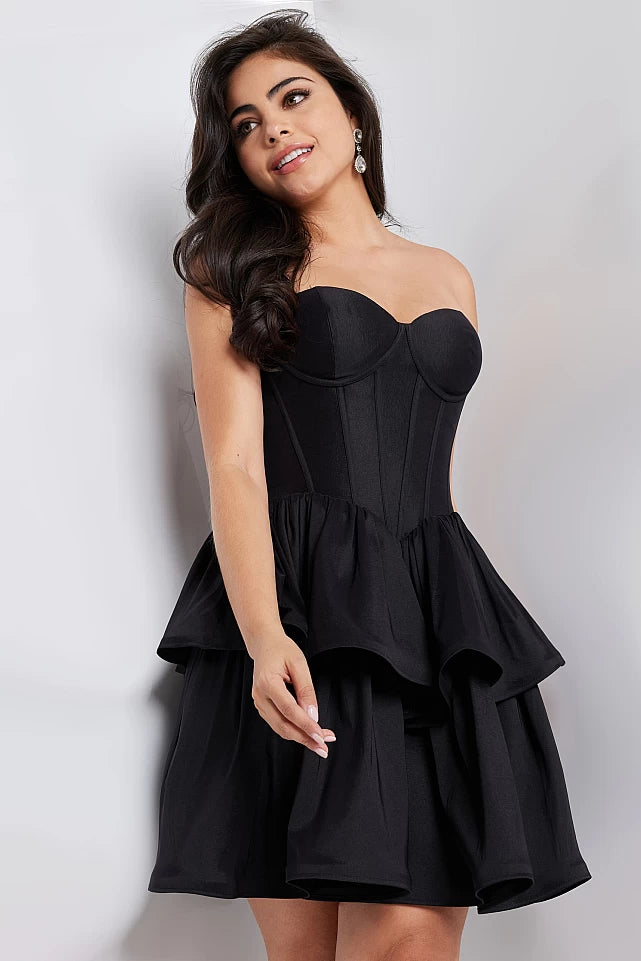 JVN36620 Fit and Flare Strapless Corset With Ruffles Homecoming Dress. The JVN36620 Strapless Corset Dress is sure to make you the center of attention. Made with a corset-style back and ruffles throughout the skirt, this fit and flare dress is perfect for special occasions. The strapless design accentuates your curves, while the ruffles bring a feminine touch.