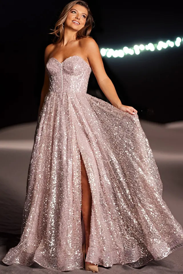 Get ready to sparkle in style with the JVN38607 prom dress! This strapless gown features a corset bodice and sweetheart neckline, creating a flattering A-line silhouette. The shimmering fabric adds a touch of glam, perfect for prom or any special occasion. Shine bright in this one-of-a-kind dress.
