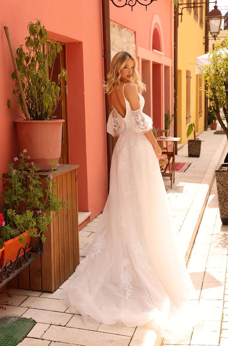 Amarra Bridal 84232 Jennifer A-Line Ballgown Spaghetti Straps Puff Sleeves Plunging Neckline Floral Tulle Train Wedding Gown. Jennifer uses classic elements intertwined with a fresh and contemporary approach. It has unique and delicate off-the-shoulder puffy sleeves with spaghetti straps.