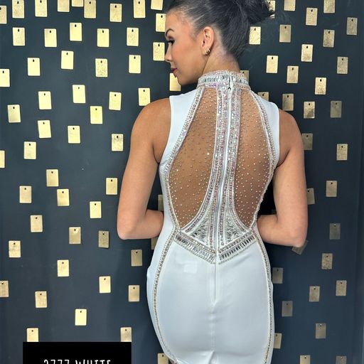 Look showstopping in this glamorous Johnathan Kayne 2777 dress. Featuring a plunging crystal V-neck, open back with zipper and choker neck, and crystal bodice, it instantly elevates your occasion style. Perfect for any homecoming look.  Sizes: 00,0,2,4,6,8,10,12,14,16  Colors: White 
