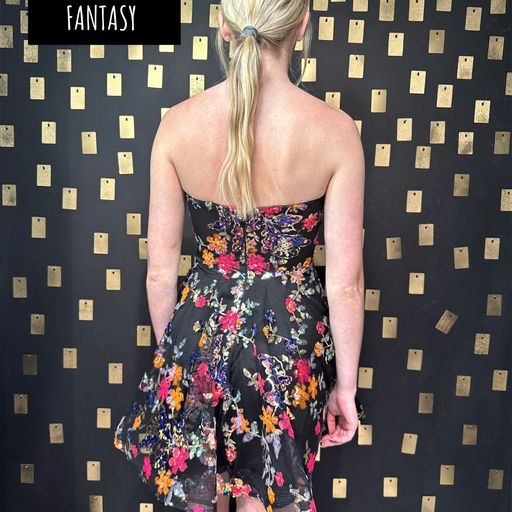 This Johnathan Kayne dress is the perfect way to make a statement on your big night! Featuring a sleek, strapless silhouette adorned with vibrant floral detailing, you'll be the star of the show! Don't miss out on this showstopper - the party starts with this dress!  Sizes: 00,0,2,4,6,8,10,12,14,16  Colors: Floral Fantasy 