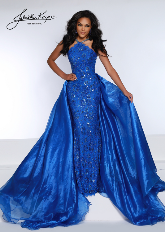 Look elegant with this Johnathan Kayne 2618 pageant dress. The high neck and sweeping long skirt are adorned with sequin lace and crystal detailing, perfect for any special occasion. Make a lasting impression.  This style is sure to be a knockout at your next pageant! Walk across stage with confidence in this halter neck beaded stretch lace fitted gown with organza overskirt.  Colors: Barbie Pink, Royal, Red, White  Sizes: 00-22