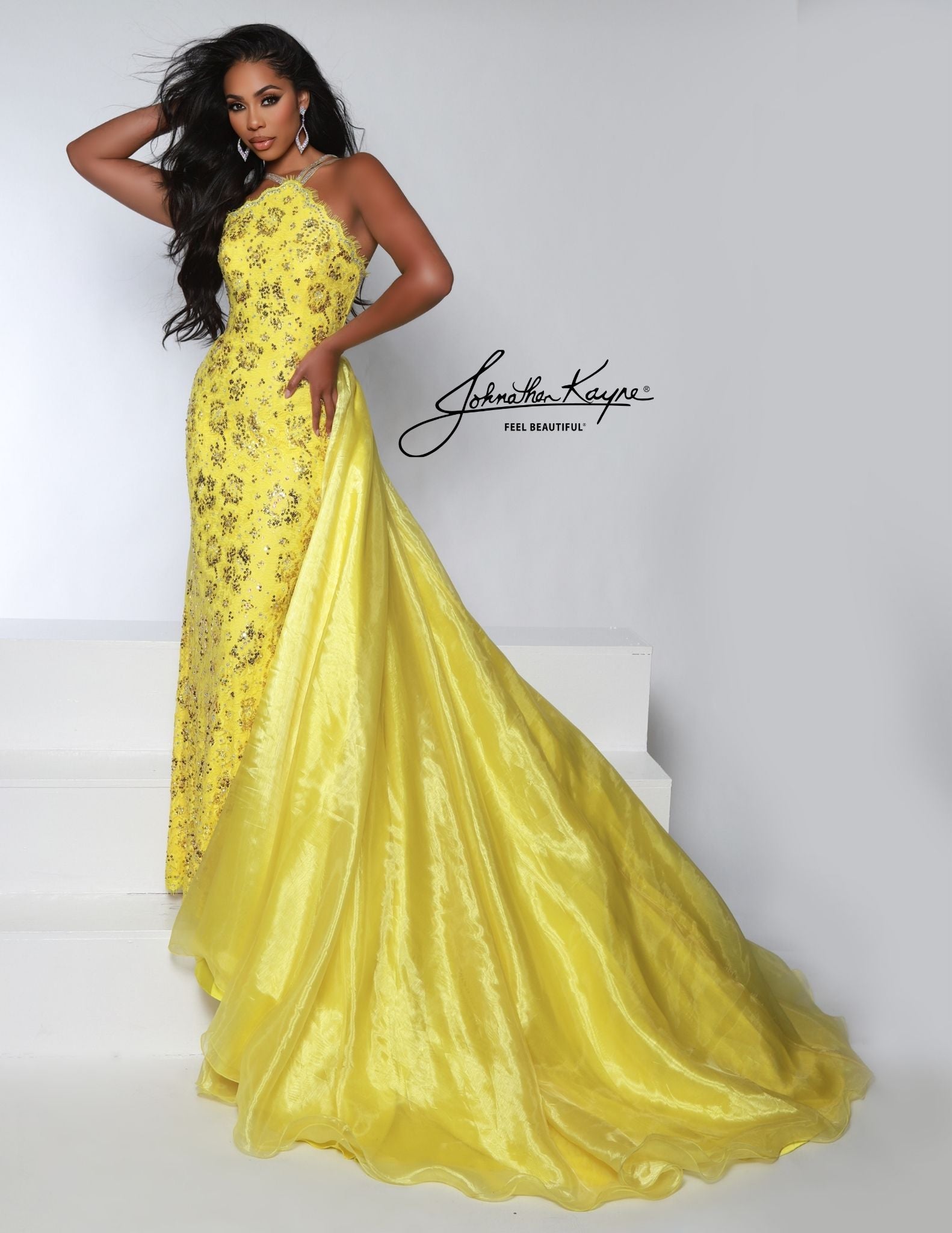 Look elegant with this Johnathan Kayne 2618 pageant dress. The high neck and sweeping long skirt are adorned with sequin lace and crystal detailing, perfect for any special occasion. Make a lasting impression.&nbsp;&nbsp;This style is sure to be a knockout at your next pageant! Walk across stage with confidence in this halter neck beaded stretch lace fitted gown with organza overskirt.