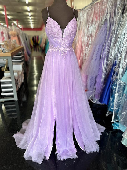 Elevate your evening with the Johnathan Kayne 2657 prom dress, featuring a delicate lilac tulle A-line silhouette that gracefully flatters size 4 figures. The intricate lace front adds timeless elegance, while the dual slits offer a modern, alluring touch. A flattering V-neckline completes this sophisticated formal gown, perfect for making a memorable statement at any special occasion. *ONE OF A KIND*

Size: 4

Color: Lilac