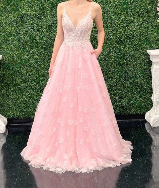 This Pink Sequin Lace Shimmer Ballgown by Johnathan Kayne features high quality sequin detailing on the bodice and skirt to create a dramatic and eye-catching look. The sleeveless bodice has a modest neckline, while the floor-length skirt adds elegance and movement for the perfect prom dress. 3d Floral Tulle Appliques and sequins cascading down the skirt.  *** One of A KIND!  Size: 2  Color: Pink