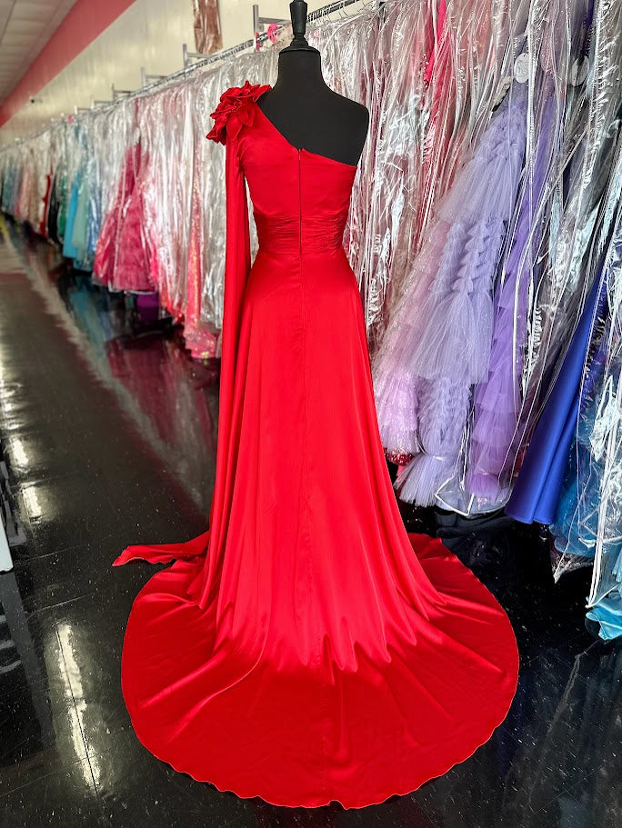 Elevate your formal occasion with this Johnathan Kayne gown, featuring a striking one-shoulder design and a flowing satin cape. The vibrant red fabric drapes elegantly, complemented by a tasteful slit and delicate floral accents. Tailored in size 4, this long dress combines classic sophistication with modern flair, perfect for pageants or special appearances.

Size: 4

Color: Red