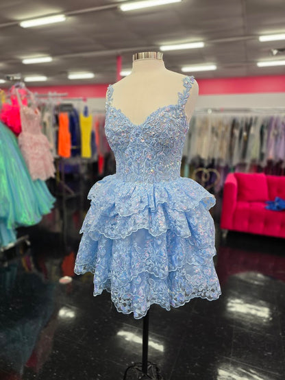 Upgrade your homecoming style with the Jovani 37080 Short Lace Ruffle Dress. The sequin embellished lace corset and asymmetrical layered short skirt create a chic silhouette, perfect for a night out. Stand out in this elegant and trendy cocktail dress. This Cocktail Dress is perfect for any formal occasion!