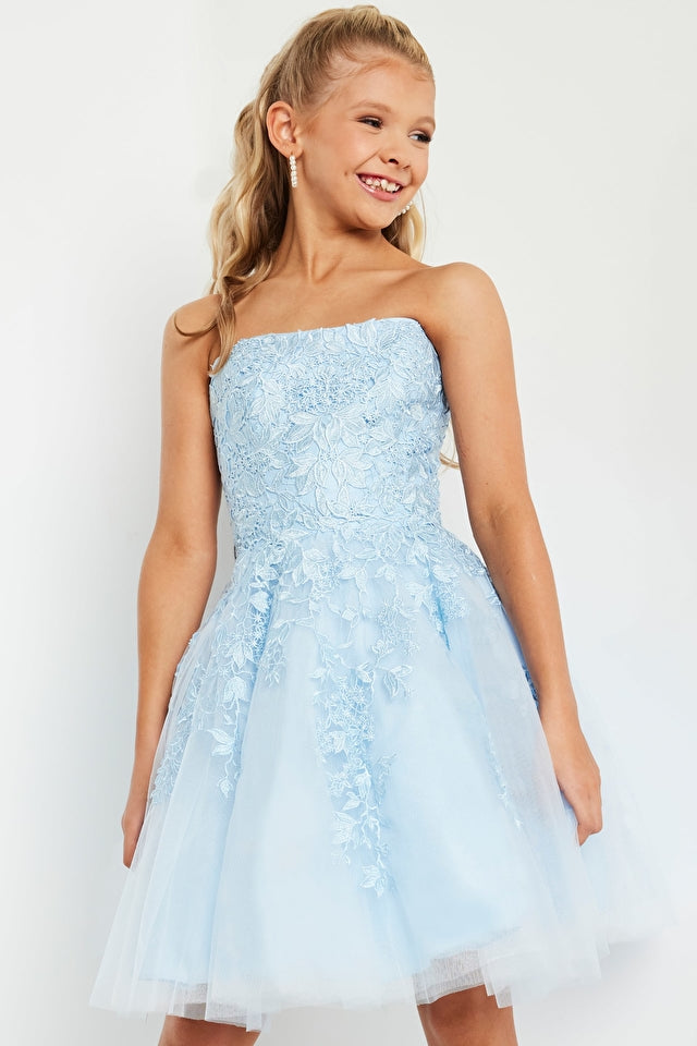Jovani Kids K1830 Fit And Flare Floral Strapless Short Girls Dress. This Jovani Kids K1830 dress is perfect for your little girl's next big event. With its modern floral print, fit and flare silhouette, and strapless style, it's sure to add a touch of fashion flair that will make her stand out from the crowd! She’ll feel like a princess in no time!