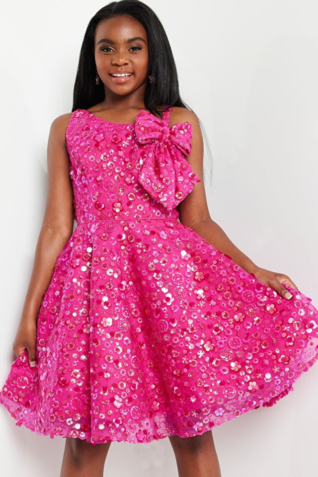 Jovani Kids K23682 Fit And Flare Sequin Bow Girls Short Dress. Sparkle and shine in style with the Jovani Kids K23682 Fit And Flare Sequin Bow Dress! This shimmering short dress features a sequin bodice and an eye-catching bow detail, perfect for any special occasion. Make it your moment to shine!