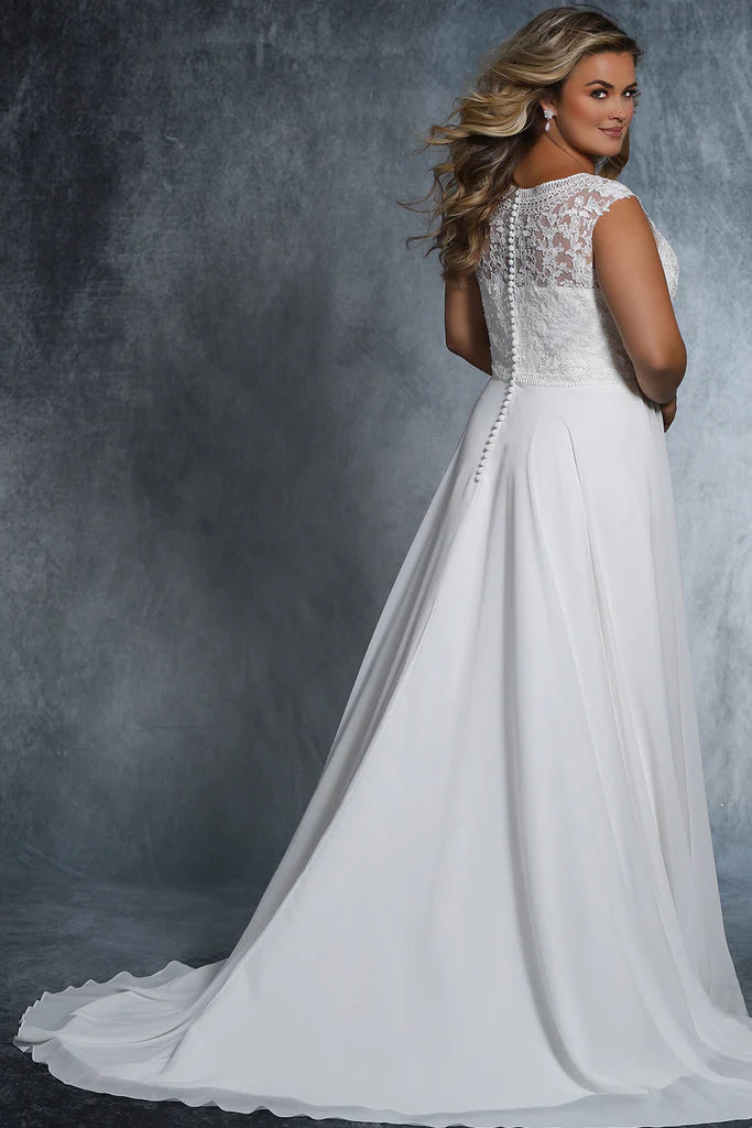Michelle Bridal For Sydney's Closet MB2021 A-Line Deep V-Neckline Small Cap Sleeves Pleated Chiffon Skirt Chapel Train Unique Embroidered Designs Plus Size "Cora" Bridal Gown. Look stunning on your special day with this beautiful Plus Size "Cora" Bridal Gown from Michelle Bridal For Sydney's Closet MB2021. This A-Line design features a deep V-Neckline, small cap sleeves, unique embroidered designs, pleated chiffon skirt, and chapel train. 