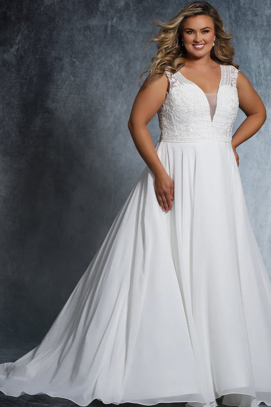 Michelle Bridal For Sydney's Closet MB2021 A-Line Deep V-Neckline Small Cap Sleeves Pleated Chiffon Skirt Chapel Train Unique Embroidered Designs Plus Size "Cora" Bridal Gown. Look stunning on your special day with this beautiful Plus Size "Cora" Bridal Gown from Michelle Bridal For Sydney's Closet MB2021. This A-Line design features a deep V-Neckline, small cap sleeves, unique embroidered designs, pleated chiffon skirt, and chapel train. 