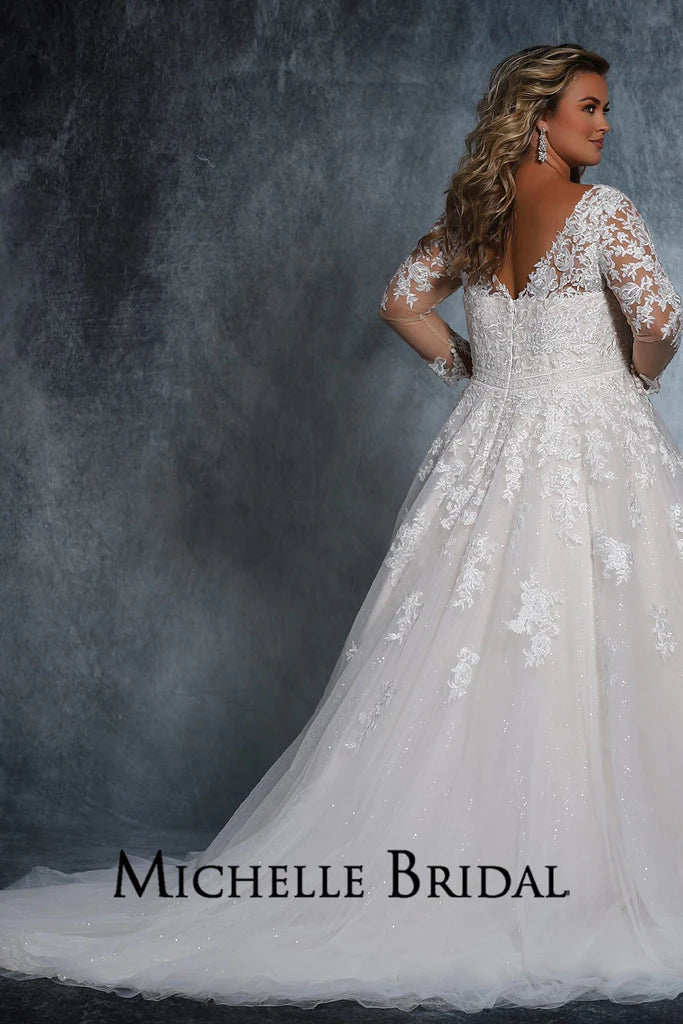 Michelle Bridal For Sydney's Closet MB2110 A-Line Long Sleeve Crystal Buttons Embroidered Floral Appliques V-Neck Plus Size "Cyndi" Bridal Gown. Look flawless in this full-length "Cyndi" bridal gown from Michelle Bridal for Sydney's Closet. This A-line dress features long sleeves, crystal buttons, embroidered floral appliques, and a V-neckline for a stunning profile. Plus size available for an impeccable fit.