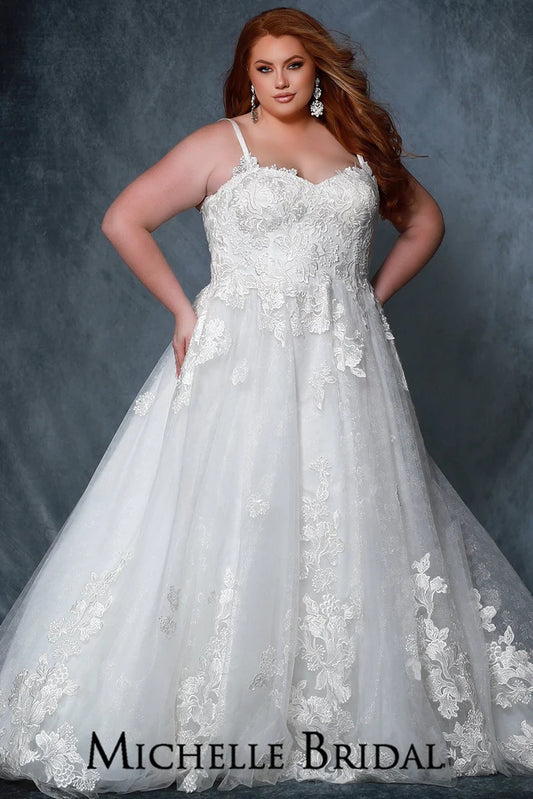 Michelle Bridal For Sydney's Closet MB2205 A-Line Silhouette Sweetheart Neckline Net Embossed With Floral Pattern Contemporary Dramatic Floral Appliques With Clear Sequins Plus Size "Fleur" Bridal Gown. Look your best on your special day with the Michelle Bridal For Sydney's Closet MB2205 Plus Size "Fleur" Bridal Gown. Featuring an A-Line silhouette with a sweetheart neckline, this net embossed gown is adorned with contemporary dramatic floral appliques and clear sequins for a truly memorable look.