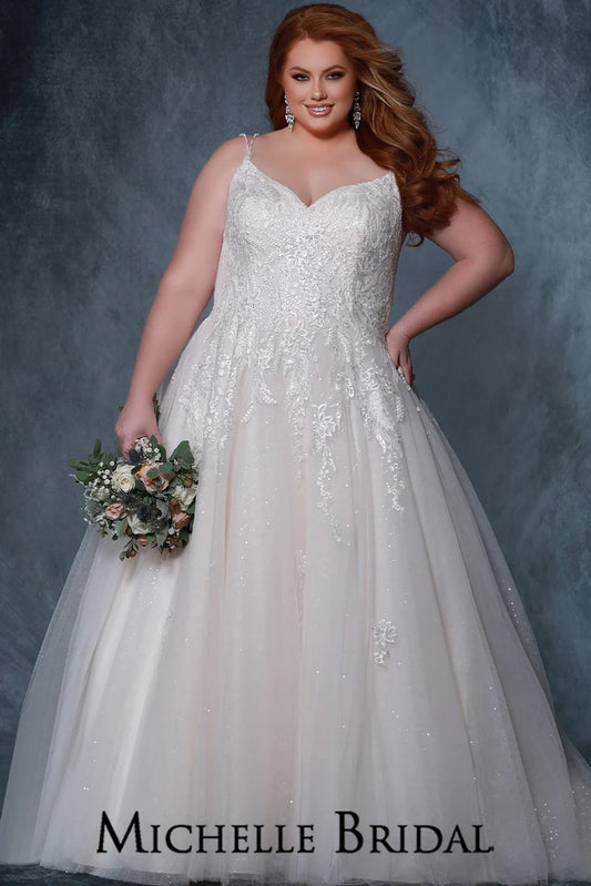 Michelle Bridal For Sydney's Closet MB2209 A-Line Silhouette V-Neck Embossed Floral Sequin Net Contemporary Floral Lace Appliques With Vines Clear Crystal Beads Clear Sequins Clear Bugle Beads Plus Size "Chloe" Bridal Gown. The Michelle Bridal For Sydney's Closet MB2209 bridal gown features an A-Line silhouette with a V-neck and a beautiful array of intricate details. Embossed floral sequin net, contemporary floral lace appliques with vines, and clear crystal beads, sequins, 