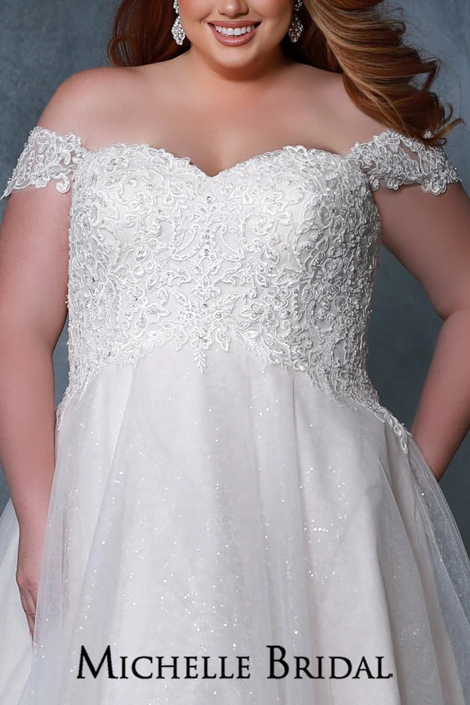 Michelle Bridal For Sydney's Closet MB2211 Ballgown Silhouette Sweetheart Neckline Strapless Optional Off The Shoulder Straps Modified Empire Lace Up Back Plus Size "Valerie" Bridal Gown. Make your special day perfect with this stunning plus size "Valerie" bridal gown from Michelle Bridal for Sydney's Closet. This beautiful gown features a ballgown silhouette, sweetheart neckline, strapless design, and optional off-the-shoulder straps. It offers a modified empire waist and a lace up back for a perfect fit.