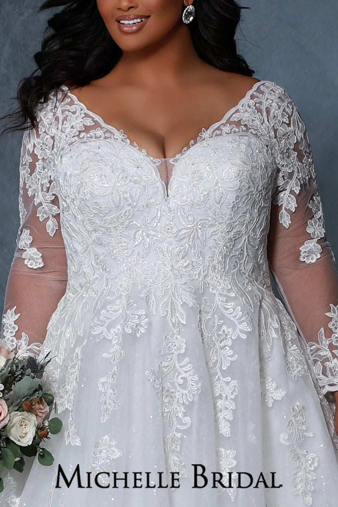 Michelle Bridal For Sydney's Closet MB2213 A-Line Silhouette Scalloped neckline Sleeves 7 Crystal Buttons On Each Sleeve Bugle Beads And Clear Sequins Plus Size "Rochelle" Bridal Gown. The Michelle Bridal For Sydney's Closet MB2213 gown is a stunning plus-size choice. It features a classic A-Line silhouette with a scalloped neckline, 7 crystal buttons on each sleeve, and beautiful bugle beads and clear sequins. Feel beautiful on your special day with this timeless design.