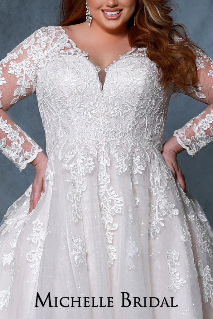 Michelle Bridal For Sydney's Closet MB2213 A-Line Silhouette Scalloped neckline Sleeves 7 Crystal Buttons On Each Sleeve Bugle Beads And Clear Sequins Plus Size "Rochelle" Bridal Gown. The Michelle Bridal For Sydney's Closet MB2213 gown is a stunning plus-size choice. It features a classic A-Line silhouette with a scalloped neckline, 7 crystal buttons on each sleeve, and beautiful bugle beads and clear sequins. Feel beautiful on your special day with this timeless design.