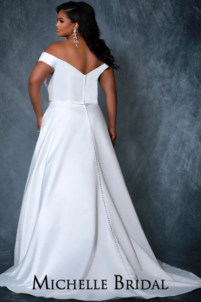 Michelle Bridal For Sydney's Closet MB2217 A-line Silhouette Off-The-Shoulder Straps Optional Satin Belt Pockets Thick Bridal Satin Plus Size "Bella" Bridal Gown. The Michelle Bridal For Sydney's Closet MB2217 bridal gown features an A-line silhouette and optional off-the-shoulder straps for extra style. Crafted with thick bridal satin and pockets, the gown also includes an optional satin belt to customize the look. Plus size available.