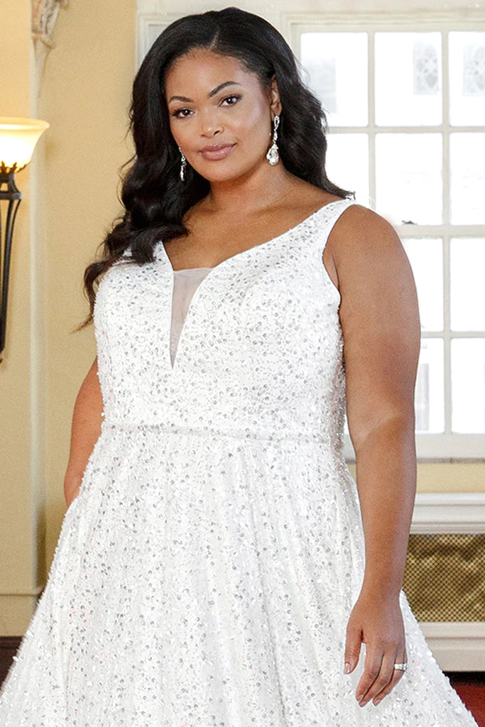 Michelle Bridal For Sydney's Closet MB2311 A-Line Ivory Mesh Silver Paillettes Clear Sequins Bugle Beads Bridal Satin Detachable Belt V-Neck Plus Size "Coco" Bridal Gown.  Be the belle of the ball in this sophisticated Michelle Bridal for Sydney's Closet wedding gown. Crafted from ivory mesh with silver paillettes, clear sequins, and bugle beads, the detachable bridal satin belt cinches the A-line silhouette and V-neckline for a resplendent look. Perfect for plus size brides, 