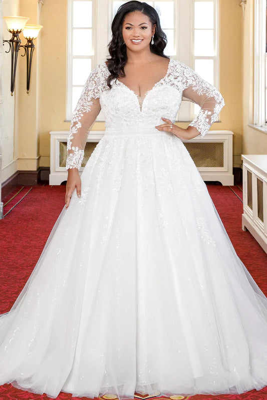 Michelle Bridal For Sydney's Closet MB2316 A-Line Embroidered Floral Appliques Clear Sequins Bugle Beads Petal Beads Bridal Tulle Floral Lace Long Sleeves Covered Buttons V-Neck Plus Size "Cleo" Bridal Gown. Michelle Bridal for Sydney's Closet MB2316 features an elegant a-line silhouette with stunning embroidered floral appliques, clear sequins, bugle beads, and petal beads. Crafted with luxurious bridal tulle and floral lace, the gown has long sleeves and covered buttons at the V-neckline. 