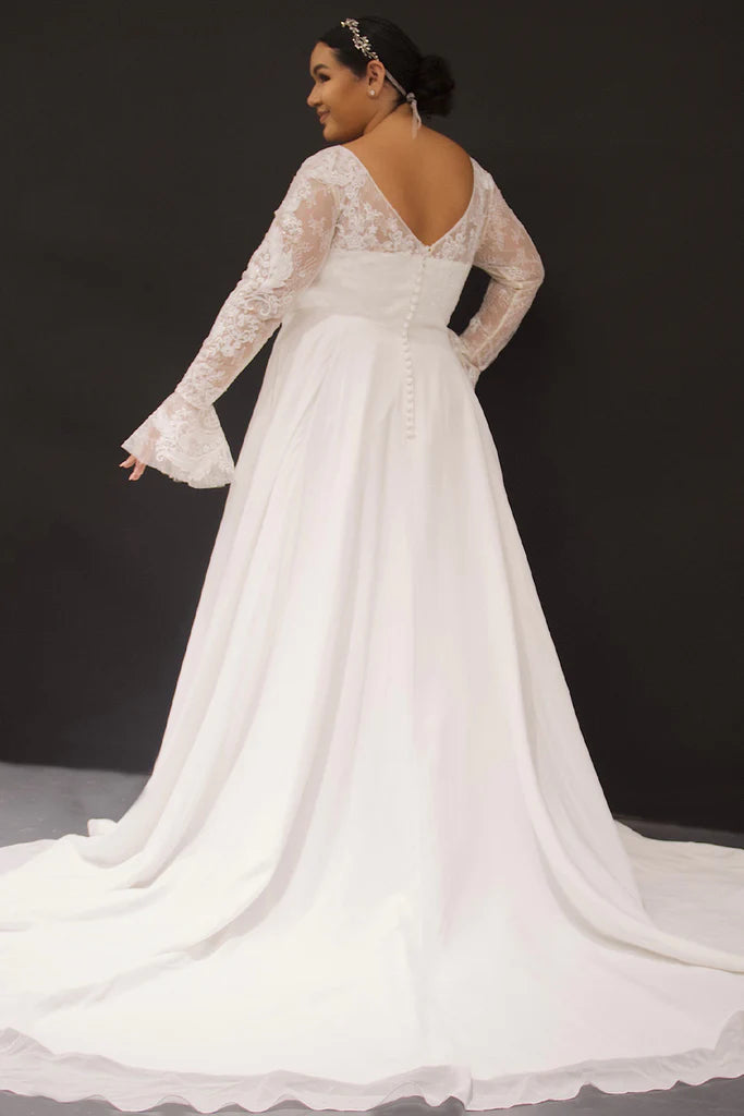 Michelle Bridal For Sydney's Closet MB2319 A-Line Lace Chiffon Net Long Sleeves With Detachable Cuff V-Bodice Plus Size "Hedy" Bridal Gown. Michelle Bridal's MB2319 A-Line "Hedy" Bridal Gown provides a timeless silhouette with luxurious detailing. Features include a lace chiffon net material, V-bodice, plus size, and detachable cuffs for a look of sophistication and elegance. Perfect for any marriage celebration, this gown is sure to impress.