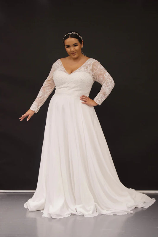 Michelle Bridal For Sydney's Closet MB2319 A-Line Lace Chiffon Net Long Sleeves With Detachable Cuff V-Bodice Plus Size "Hedy" Bridal Gown. Michelle Bridal's MB2319 A-Line "Hedy" Bridal Gown provides a timeless silhouette with luxurious detailing. Features include a lace chiffon net material, V-bodice, plus size, and detachable cuffs for a look of sophistication and elegance. Perfect for any marriage celebration, this gown is sure to impress.