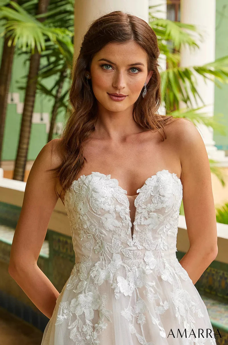 Amarra Bridal 84389 Madison A-Line Ballgown Sweetheart Neckline Strapless Floral Tulle Train Wedding Gown. This truly romantic wedding gown is perfect for the classic bride who wants to keep things traditional, but add her own elegant twist. Madison does just that, featuring a delicate V-neckline and floral lace appliques throughout the bodice, cascading down to a wide, billowy skirt. 