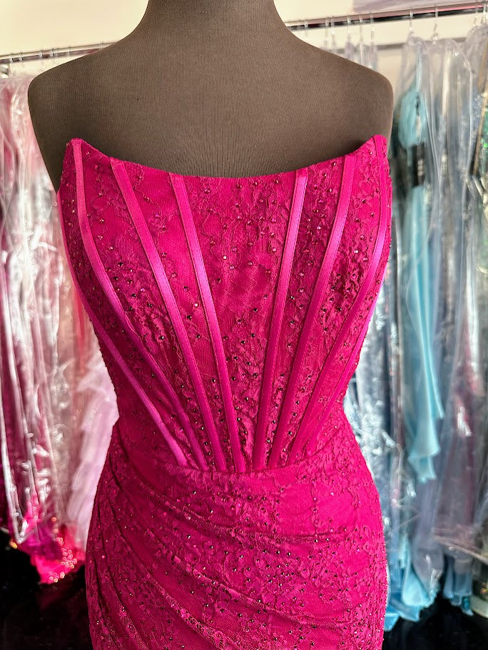 Elevate your formal occasion with the Nina Canacci 6646 prom dress, featuring a delicate long lace corset design in a striking magenta hue. This gown showcases a flattering scoop neckline and a tasteful slit, combining elegance with a hint of allure. it offers a refined silhouette perfect for making a memorable entrance.

Size: 0,&nbsp; 4

Color: Fuchsia