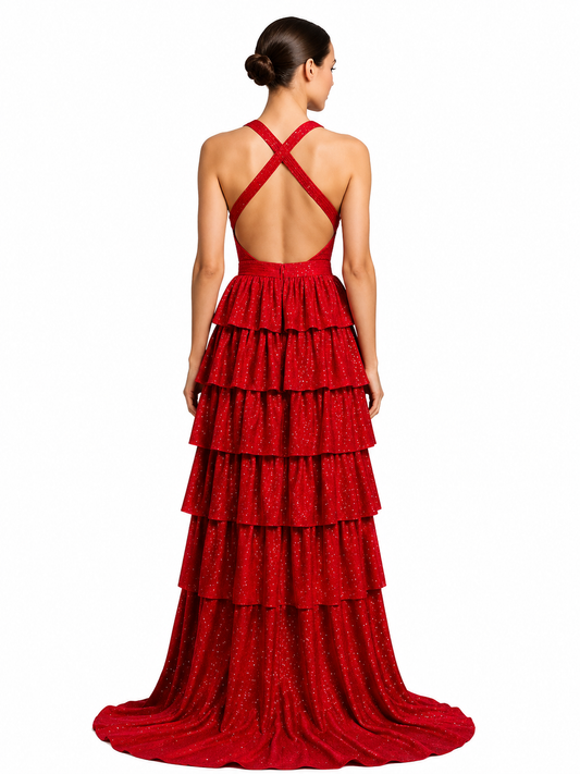 Nina Canacci's 9200 is a show-stopping pageant gown that combines elegance with contemporary flair. The crystal-layered jersey skirt features intricate micro crystal embellishments that catch light beautifully, while strategic side cutouts add modern sophistication. A dramatic maxi slit and flowing train create movement and grandeur, making this dress ideal for prom, pageants, and formal competitions. The jersey construction ensures comfortable wear throughout the evening while maintaining a polished silhou