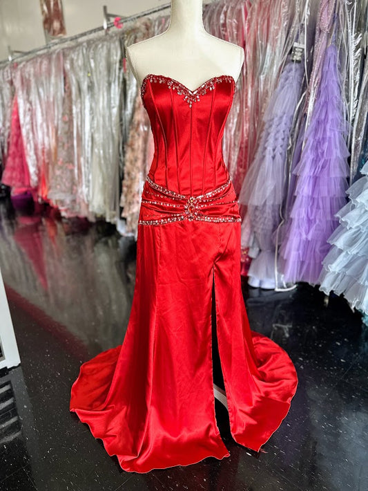 This Nina Canacci J4098 prom dress in size 12 features a striking red satin fabric that flows into a long, elegant silhouette. The corset bodice provides structured support and a flattering fit, enhanced by intricate beading and sequin details that add subtle sparkle. A thigh-high slit lends a modern, alluring touch, making this gown a sophisticated choice for formal occasions. Ideal for those seeking a blend of classic elegance and contemporary style.

Size: 12

Color: Red