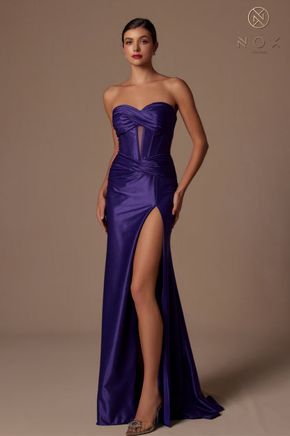 This Nox Anabel T1489 Satin Prom Dress features a fitted silhouette and a daring slit, perfect for a formal evening event. The cutout strapless corset bodice adds a touch of elegance and femininity. Made with high-quality satin, this gown will make you stand out with its sleek and sophisticated design.

Sizes: 00-16

Colors: Black, Gold, Plum, Deep Red, Ocean Blue