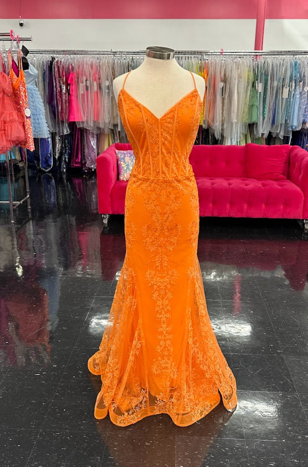 Stella Couture 21066 is a stunning V neckline glitter embellished fitted mermaid prom &amp; Pageant Dress. Featuring a corset design bodice with boning and a v neckline. Lush mermaid silhouette with a sweeping train. sheer back. Great for Prom &amp; Pageant

Available Size: 20

Available Color:&nbsp;Orange (Bright)