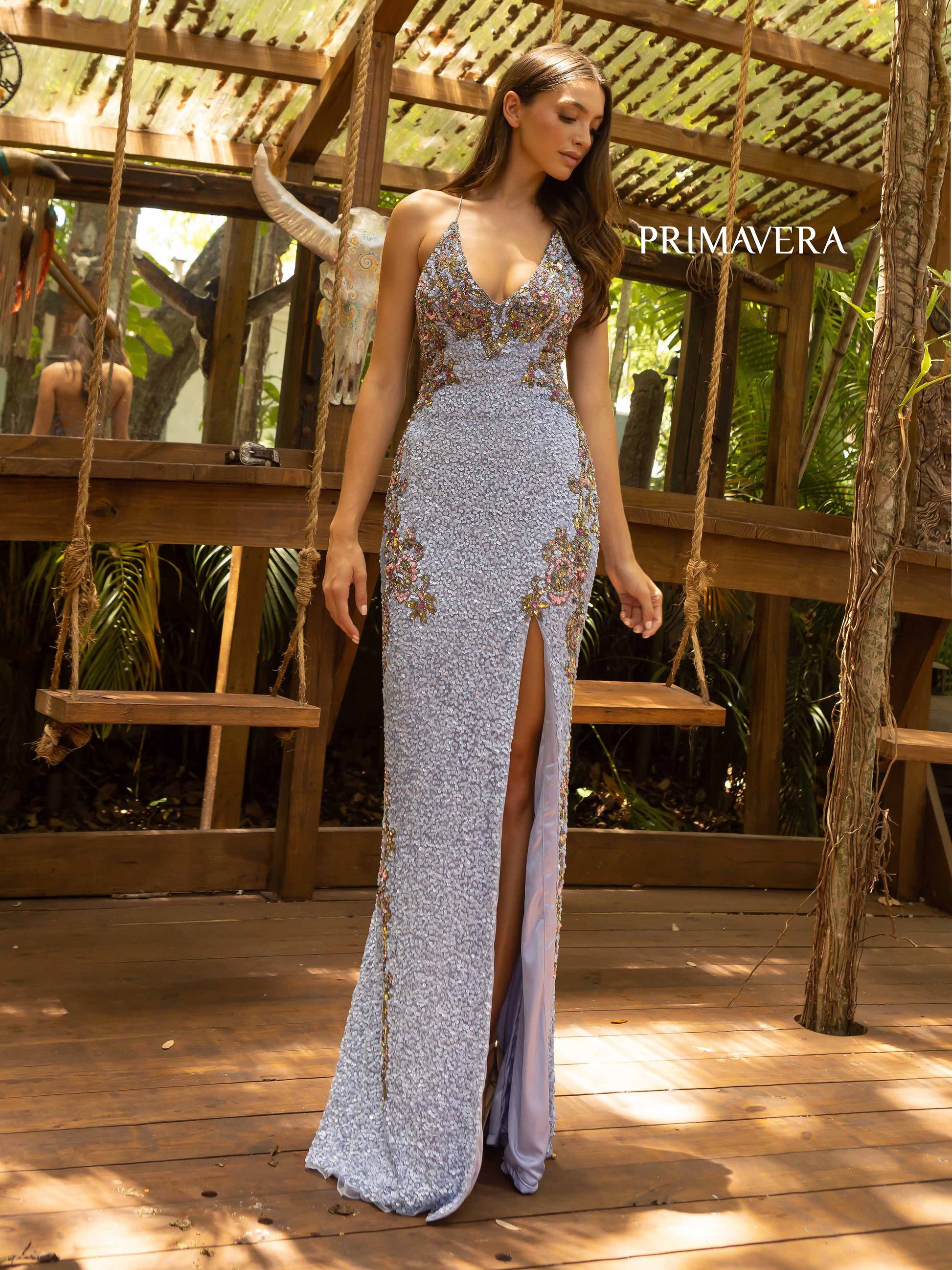 Primavera Couture 3211 Lilac  is a Long fitted sequin Embellished Formal Evening Gown. This Prom Dress Features a deep V Neck with an open Corset lace up back. Beaded & embellished elegant scroll pattern accentuate curves. Fully beaded prom dress with floral pattern and side slit. Long Sequin Gown featuring a v neckline. slit in the fitted skirt, Slit in Thigh. Stunning Pageant Dress, Prom Gown & More! front