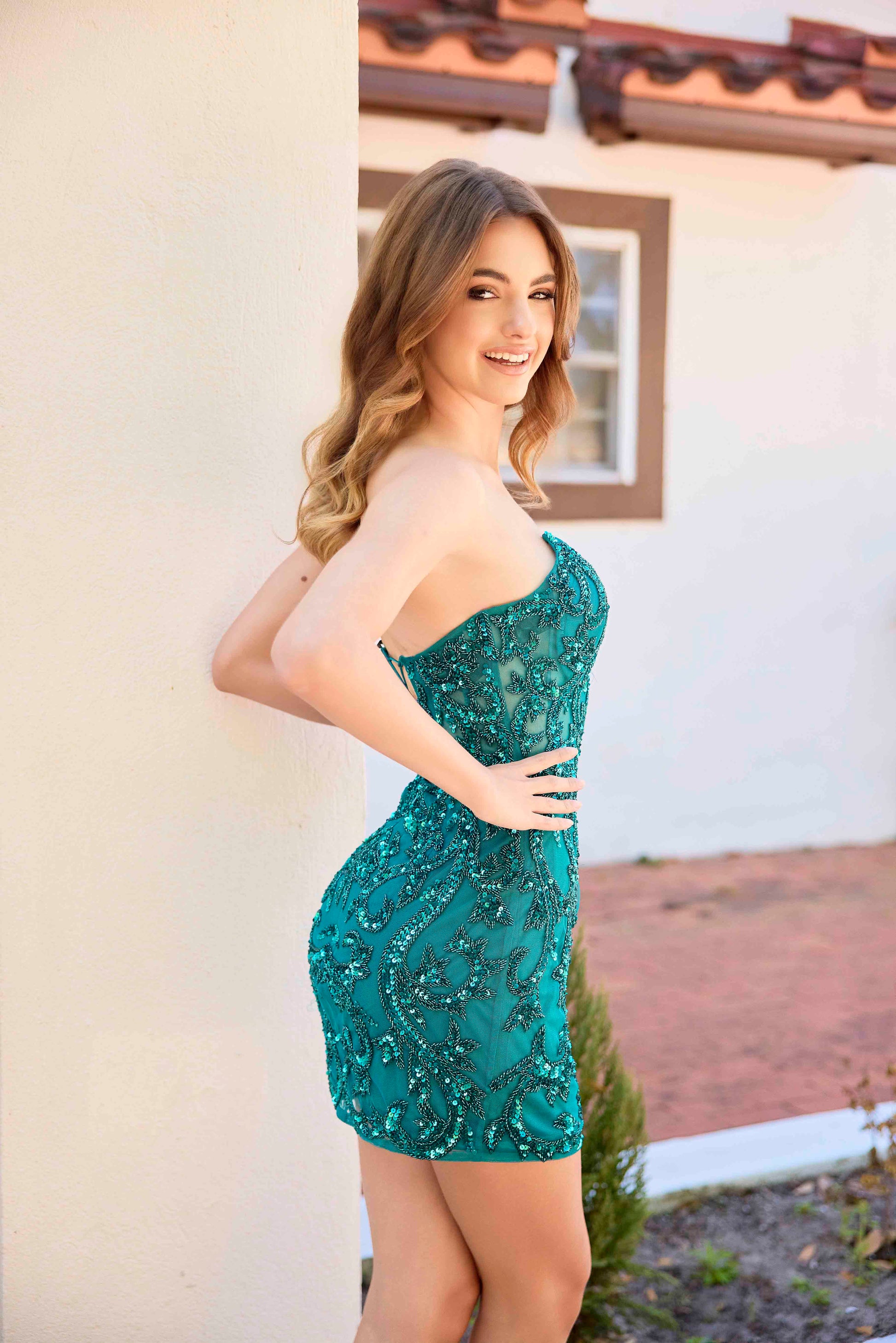 The Primavera Couture 4430 is a sophisticated short cocktail dress featuring a sheer beaded corset that enhances the silhouette with intricate detailing. Its strapless design and V-neckline offer a flattering, elegant look perfect for homecoming or special occasions. The sequin embellishments add a subtle shimmer, making this gown a standout choice for those seeking a blend of glamour and refined style.

Sizes: 000-16

Colors: Red, Black, Gold, Teal