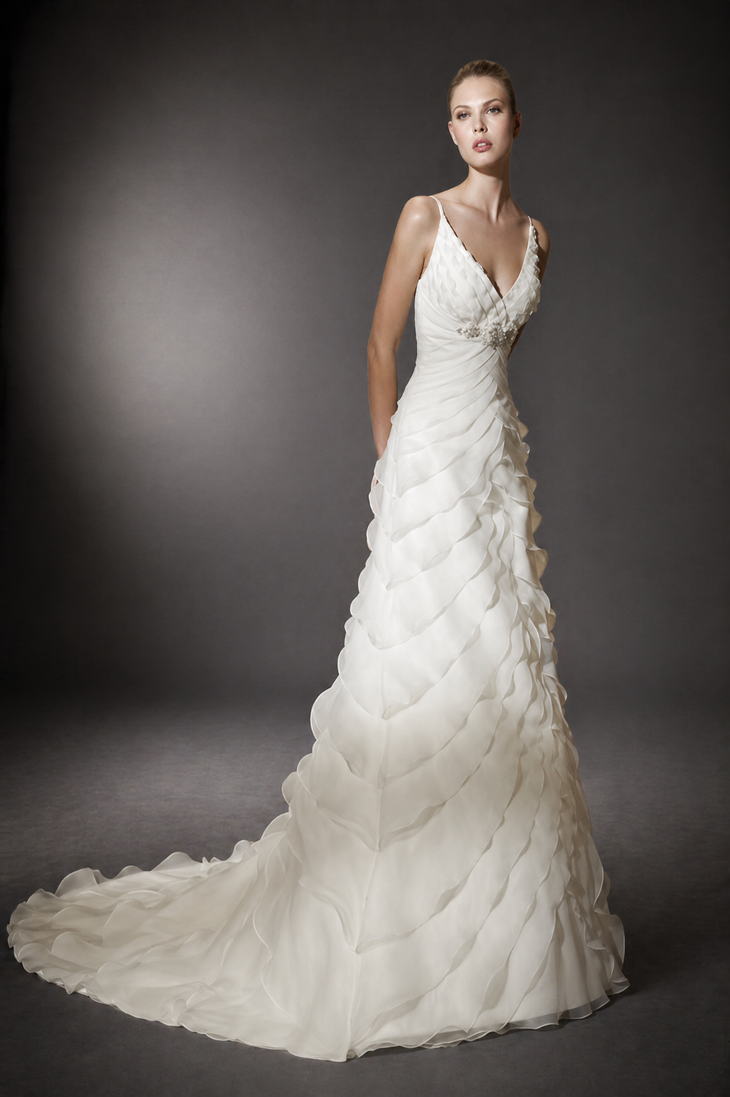 DESIGNER: San Patrick&nbsp; &nbsp; &nbsp;SIZE: 8&nbsp; &nbsp; COLOR: Ivory

STYLE: CANARIAS by Pronovias&nbsp;

Silhouette: Trumpet Neckline: V-neck

Waistline: Empire Waist Sleeve Style: Sleeveless

Dress Length: Floor Length&nbsp;

This is a stunning wedding dress by San Patrick (a division of Pronovias), style Canarias, in beautiful ivory stiff organza. Brilliant fabric on this high quality gown. Flattering trumpet silhouette. The beadwork is jaw-dropping with huge Swarovski crystals. This is an authenti
