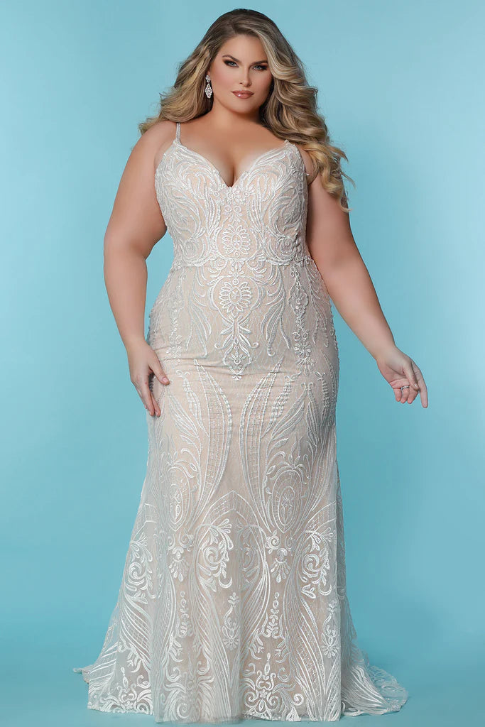 Sydneys Coset SC5287 Jolene Plus Size Bridal Dress. The Sydneys Coset SC5287 Jolene Plus Size Bridal Dress features an opulent, intricate bodice and cascading layers of matte chiffon on the skirt. Its timeless silhouette is cut to flatter the female form, and create an elegant statement as you take your place at the altar. This exquisite dress is designed exclusively for the plus size bride and is sure to make a lasting impression on your special day.