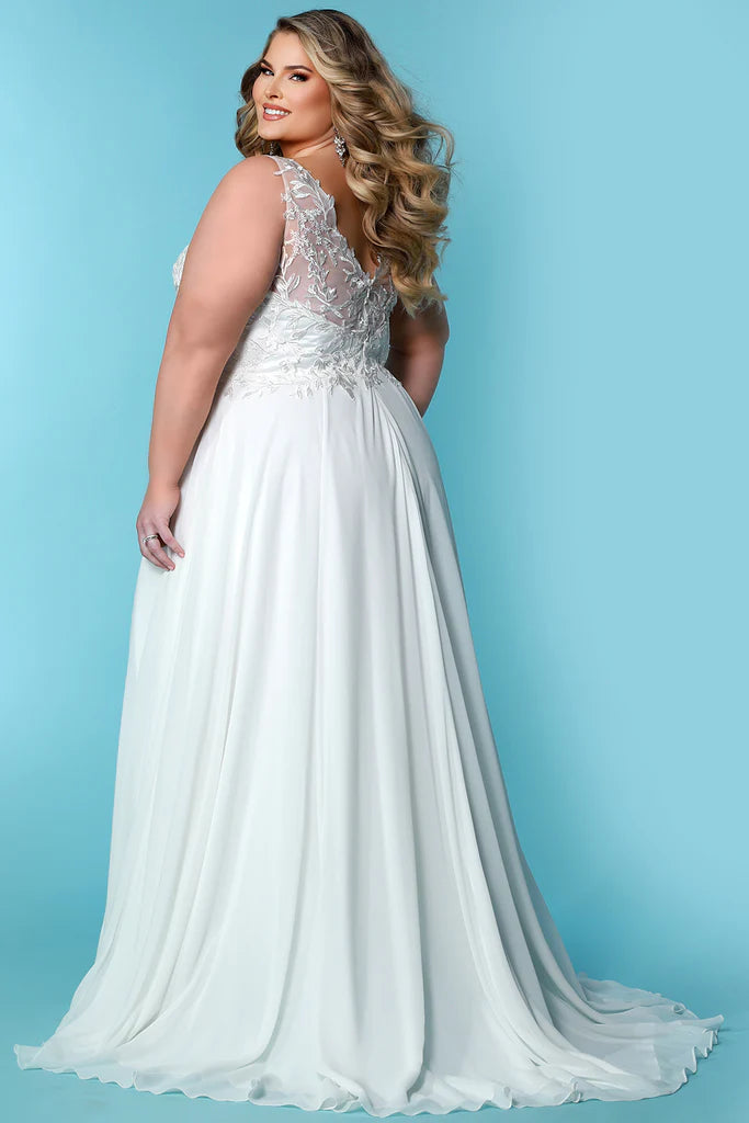 Sydneys Closet SC5295 Theodora Ivory Bridal Dress. Experience an exclusive and sophisticated look with Sydneys Closet SC5295 Ivory Bridal Dress. This beautiful dress features elegant, timeless styling with graceful lines and sumptuous fabrics, guaranteeing a luxurious and unforgettable bridal look that will be cherished for years to come.