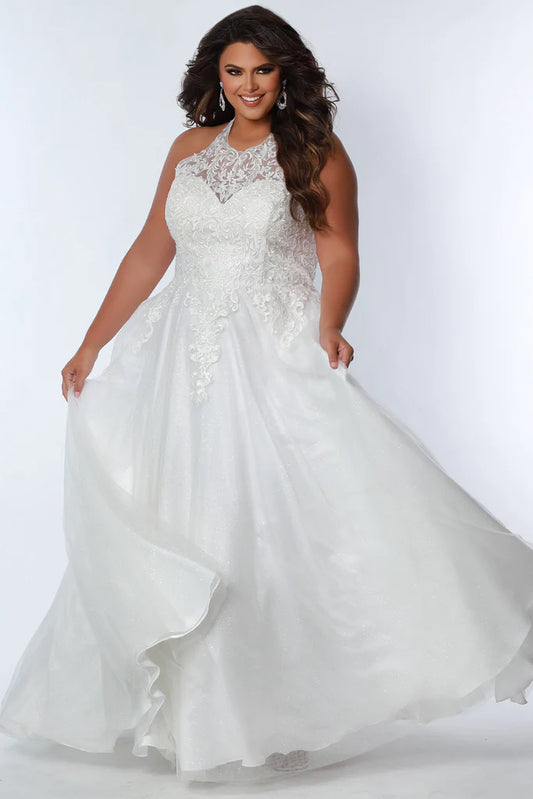 Sydney's Closet SC7352 A-Line Glitter Tulle Lace Appliques Lace Up Back Halter Neckline Plus Size Prom Dress. The Sydney's Closet SC7352 A-Line Glitter Tulle Lace Appliques Plus Size Prom Dress makes a glamorous addition to your wardrobe. This chic dress features an A-line silhouette, glitter tulle overlay, and delicate lace appliques - all crafted with an adjustable lace-up back and halter neckline. An elegant choice for formal occasions.