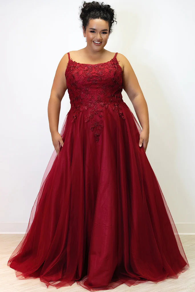 Sydney's Closet SC7357 A-Line Scoop Neck Tulle Lace Appliques Plus Size Prom Dress.  You'll be the belle of the ball in Sydney's Closet SC7357 A-Line Prom Dress! Flattering A-line skirt with scoop neck and lace appliques make you look like a real star. Get ready to dazzle in this plus size stunner! #HollaIfYouHeardItHereFirst