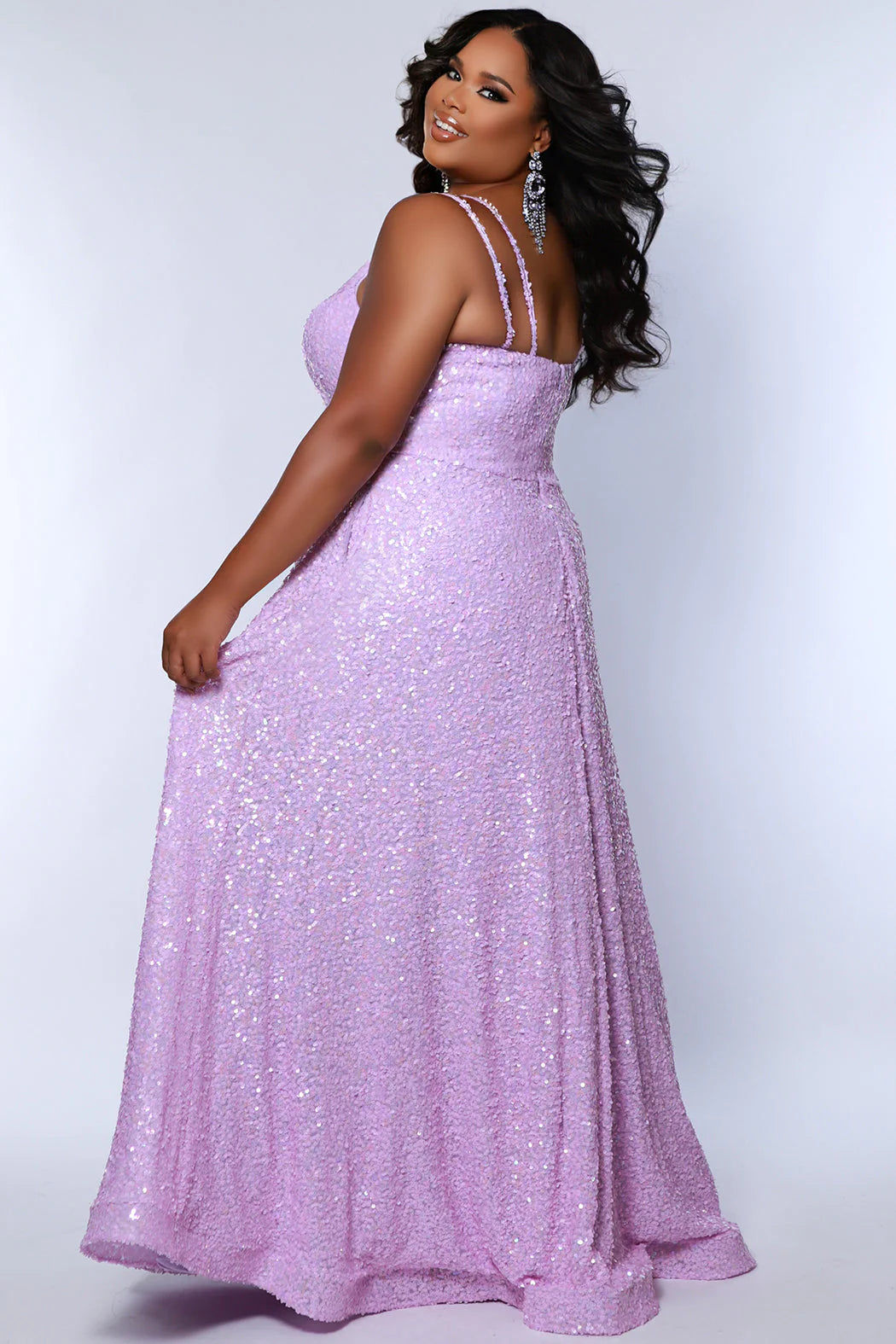 Be the belle of the ball in Sydneys Closet SC7365 Long Prom Dress. This plus size formal dress features an all-over sequin bodice with a scoop neckline, and a gathered A-line skirt with pockets. Perfect for prom nights, the elegant style of this gown will make you feel like a star.