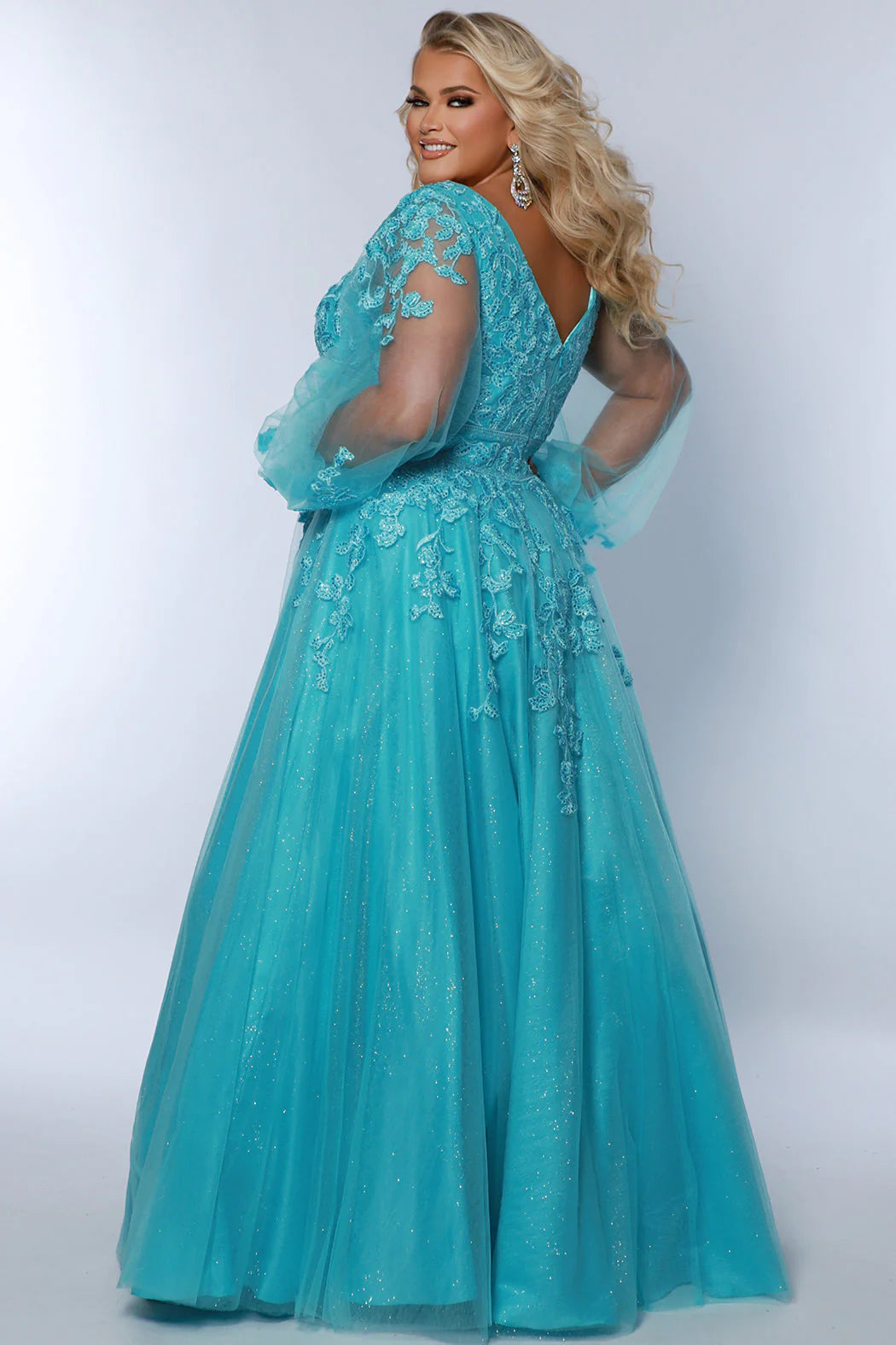 Turn heads in Sydneys Closet SC7373 Long Prom Dress. The sequin and plus size puff sleeves make this A-Line formal gown remarkably elegant, while the plush material provides maximum comfort for your special night. Make a statement with this beautiful dress. You will look pretty fancy at Prom 2024 or any special event when you opt to wear this plus size formal dress with sleeves.