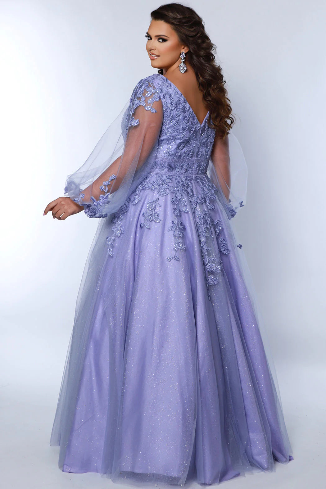 Turn heads in Sydneys Closet SC7373 Long Prom Dress. The sequin and plus size puff sleeves make this A-Line formal gown remarkably elegant, while the plush material provides maximum comfort for your special night. Make a statement with this beautiful dress. You will look pretty fancy at Prom 2024 or any special event when you opt to wear this plus size formal dress with sleeves.
