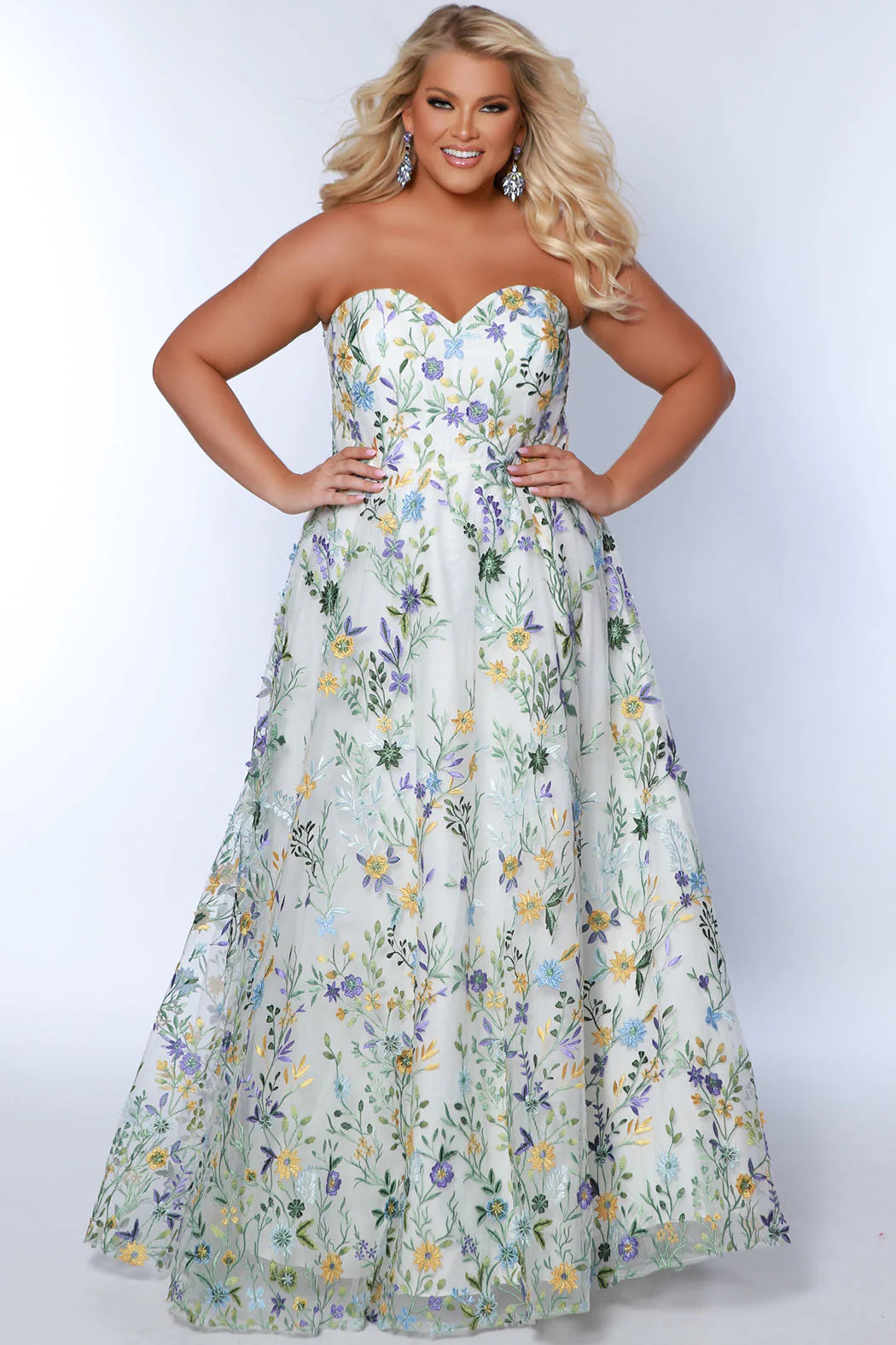 This Sydneys Closet SC7381 long prom dress is perfect for formal occasions or special evenings out. Featuring a plus size A-line silhouette, a sweetheart neckline, and a striking floral pattern, this stylish dress is sure to bring a touch of elegance and glamour to your look. Unleash your romantic side in our 'Watch Me Bloom' formal dress! 