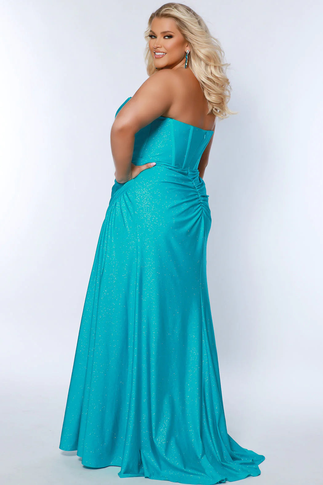 Look stunning in Sydneys Closet’s SC7390 Long Fitted Plus Size Strapless dress. The strapless corset design, ruched maxi skirt with a train, and slit tailoring combine for a modern-yet-elegant style. The perfect gown for formal and pageant occasions. Make a trendy fashion statement at Prom 2024 in our In Your Dream sexy plus size corset top formal.  Flattering exposed boning on bustier top accentuates your curve in just the right places on the bodice. 