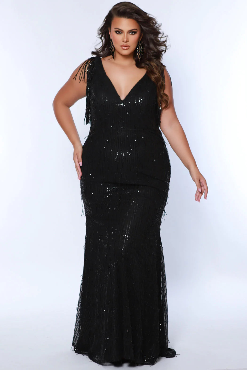 Enchanting sequin fringe cascades down the bodice of this plus size pageant dress. Its fitted silhouette and flattering V neckline provide an eye-catching look that is sure to turn heads. Perfect for your next formal event! Look glamourous at your next big fancy event when you arrive wearing our Spur of the Moment plus size fringe evening gown. Classic sequin slim formal dress updated with trendy fringe embellishment on the fitted bodice and fitted skirt for a very playful embellishment. 